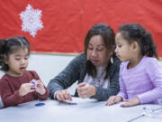 Dianna Johnson (center) plays with Mary Bilimon, 2 (left) and Jera Maun, 5, during their play group class at Childhaven in Auburn Tuesday, Jan. 9, 2024. (Ellen M. Banner/The Seattle Times/TNS) (Ellen M.