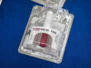 A container of Narcan, a brand name version of the opioid overdose-reversal drug naloxone, sits on a table following a demonstration at the Department of Health and Human Services on Sept. 8 in Washington.