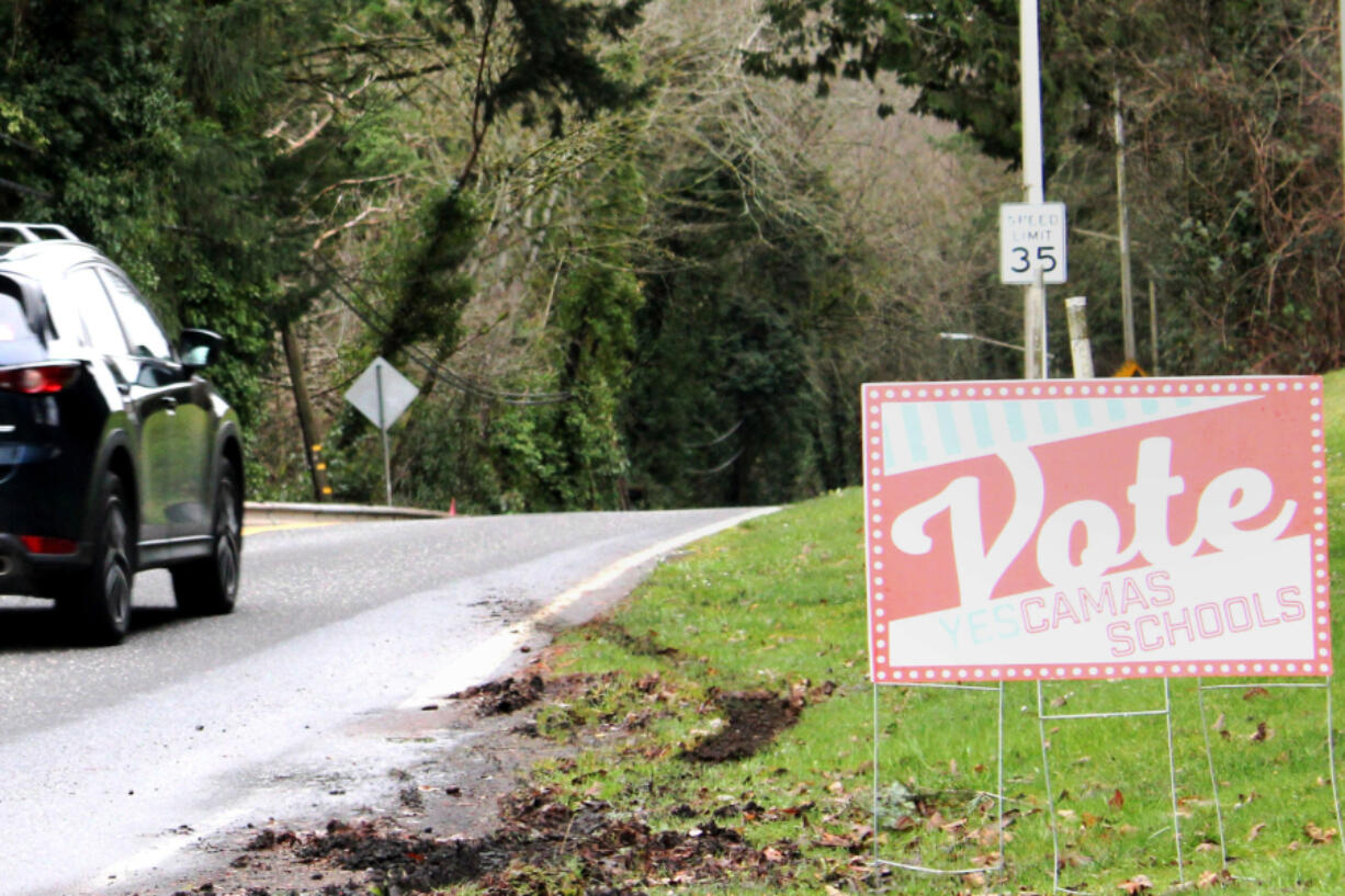 Drivers pass a sign supporting Camas School District&rsquo;s replacement levies, near the corner of Northwest Lake Road and Northwest Sierra Street.