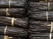 Bundles of raw vanilla beans are stacked up Wednesday, Jan. 17, 2024, at Vanilla Bean Project in Lakeland, Minnesota. The small Minnesota company is the first in the world to offer Regenerative Organic Certified vanilla extracts.