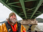 Bob Sallinger, executive director of Bird Conservation Oregon, touring the Astoria-Megler Bridge, issued warnings years ago about relocating cormorants from Sand Island. Photographed Dec. 13, 2023, on the waters of the Columbia River in  Astoria, Oregon.