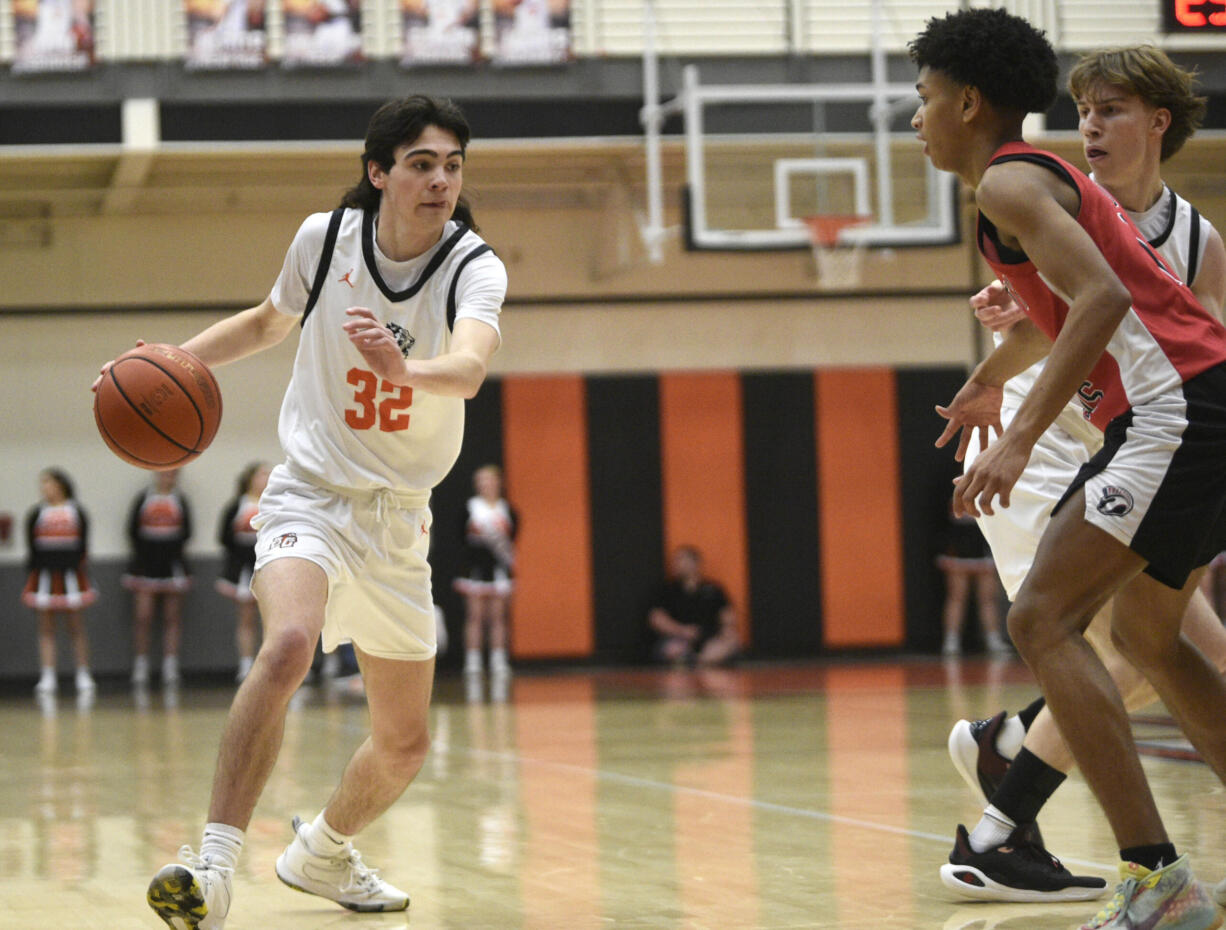 Battle Ground’s Trey Spencer (32) drives against Union during a 4A GSHL boys basketball game on Tuesday, Jan. 30, 2024, at Battle Ground High School.