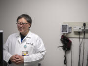 Dr. Michael Liu works behind the scenes at PeaceHealth Family Medicine of Southwest Washington on Jan. 8.