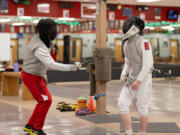 Student London Lockwood protests after losing a hard-fought point to coach Nathaniel Holzgrafe.