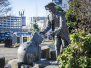 A statue of Capt. George Vancouver sits across from Vancouver City Hall.