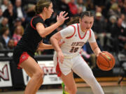 Union sophomore Brooklynn Haywood, right, moves around Camas junior Sophie Buzzard on Tuesday, Jan. 2, 2024, during the Titans’ 65-43 loss to Camas at Union High School.