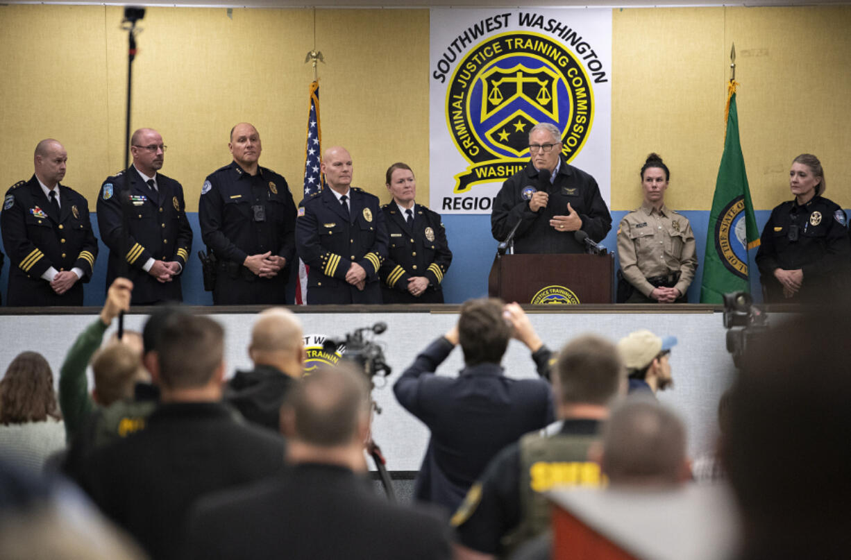 Gov. Jay Inslee speaks to the crowd from a podium Friday morning while celebrating the opening of Clark County&rsquo;s new law enforcement academy in east Vancouver. The new training center is temporarily in the former location of Image Elementary School.