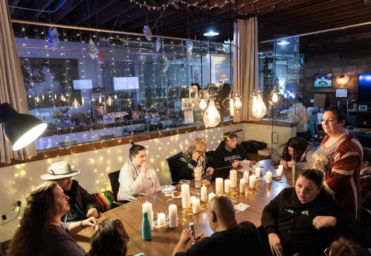 Attendees work on stamping their words of intention for 2024 onto keychains Jan. 3 at Couve Collective.