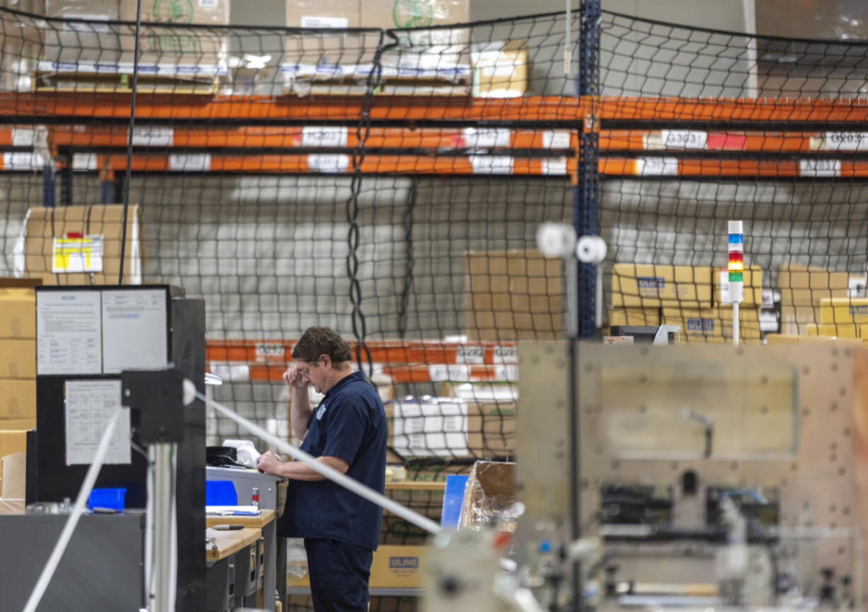 An employee works at ePac Flexible Packaging at the Vancouver Innovation Center in east Vancouver. The industrial center has undergone an extensive renovation since developers bought it in 2020.