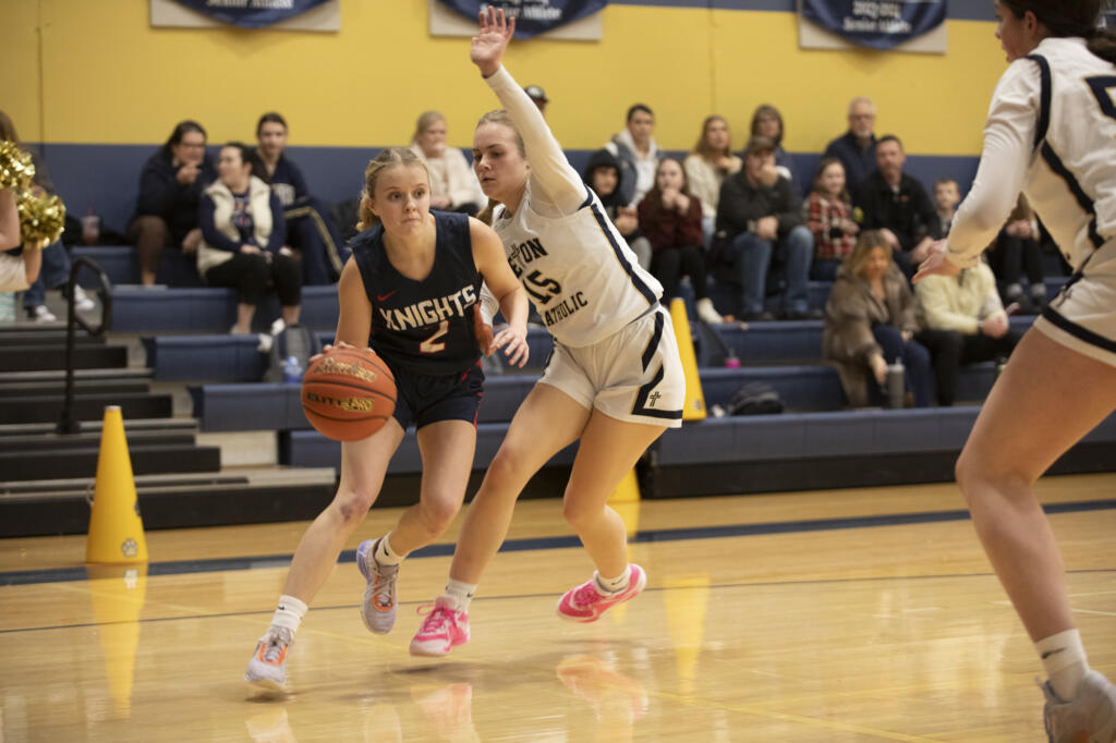 King’s Way’s Hannah Erwin moves past Seton Catholic's Alyssa Mancuso during a Trico League girls basketball game at Seton Catholic High School on Thurs. Jan. 11, 2024. Seton Catholic defeated King's Way 36-22.