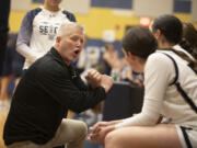 Seton Catholic's head coach Joe Potter talks to the team during a time out in a Trico League girls basketball game against King's Way at Seton Catholic High School on Thurs. Jan. 11, 2024. Seton Catholic defeated King's Way 36-22.