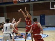 R.A. Long senior Lonnie Brown Jr. (0) takes a 3-point shot during the Lumberjacks’ 67-47 win over Hockinson in a 2A Greater St. Helens League boys basketball game at Hockinson High School on Thursday, Jan. 11, 2024.