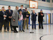 Scout Eldridge, student at Gause Elementary School, is recognized by VFW Post 4278 as a State Junior Essay Contest award winner at a schoolwide assembly.