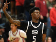 Skyview senior Demaree Collins celebrates a three Tuesday, Jan. 23, 2024, during the Storm’s 69-66 loss to Camas at Camas High School.