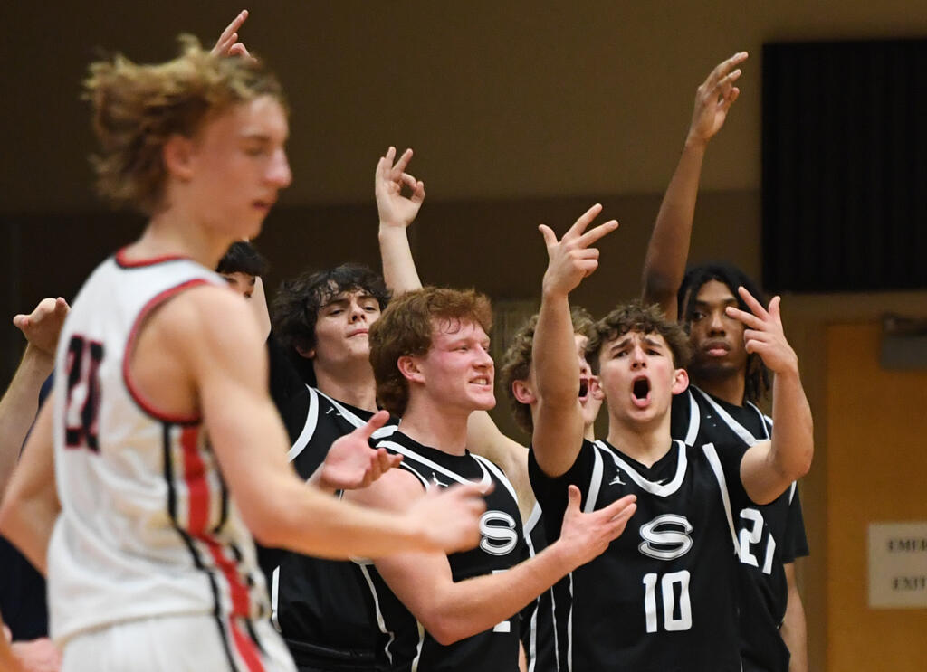 Skyview players celebrate a basket Tuesday, Jan. 23, 2024, during the Papermakers’ 69-66 win against Skyview at Camas High School.