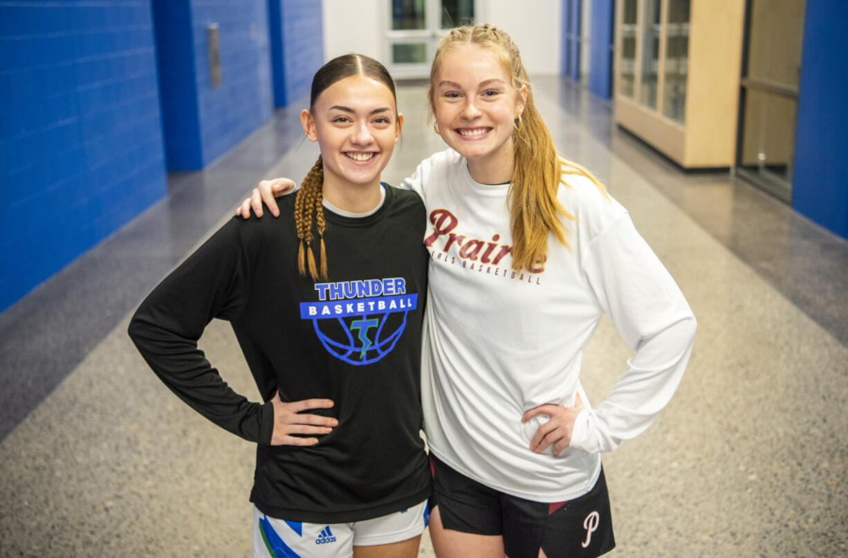 *LEADOPTION* Mountain View senior Nina Peterson, left, and Prairie senior Claire Smith stand for a portrait Wednesday, Jan. 24, 2024, at Mountain View High School. The two are longtime friends but are rivals on the court. Peterson and Smith are both attending Corban University next year.