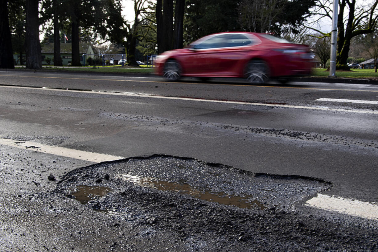 Potholes form when ice, snow or rain seeps into asphalt pavement through cracks. The moisture beneath the surface expands when temperatures drop. When it drains, a gap forms underneath the pavement, which crumbles into a pothole when a vehicle drives over it.