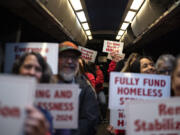 Community members, social service providers and people who have been homeless prepare to leave Vancouver for Olympia to advocate for rent stabilization Tuesday for Housing and Homelessness Advocacy Day. The advocates &mdash; as young as 9 and as old as 77 &mdash; donned red sweatshirts and packed into the bus before dawn.
