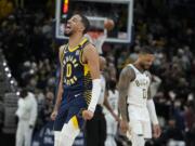 Indiana Pacers' Tyrese Haliburton (0) reacts during the second half of an NBA basketball game against the Milwaukee Bucks, Wednesday, Jan. 3, 2024, in Indianapolis.