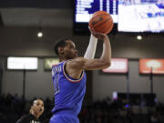 Gonzaga guard Nolan Hickman, top, shoots during the first half of an NCAA college basketball game against San Diego, Saturday, Jan. 6, 2024, in Spokane, Wash.