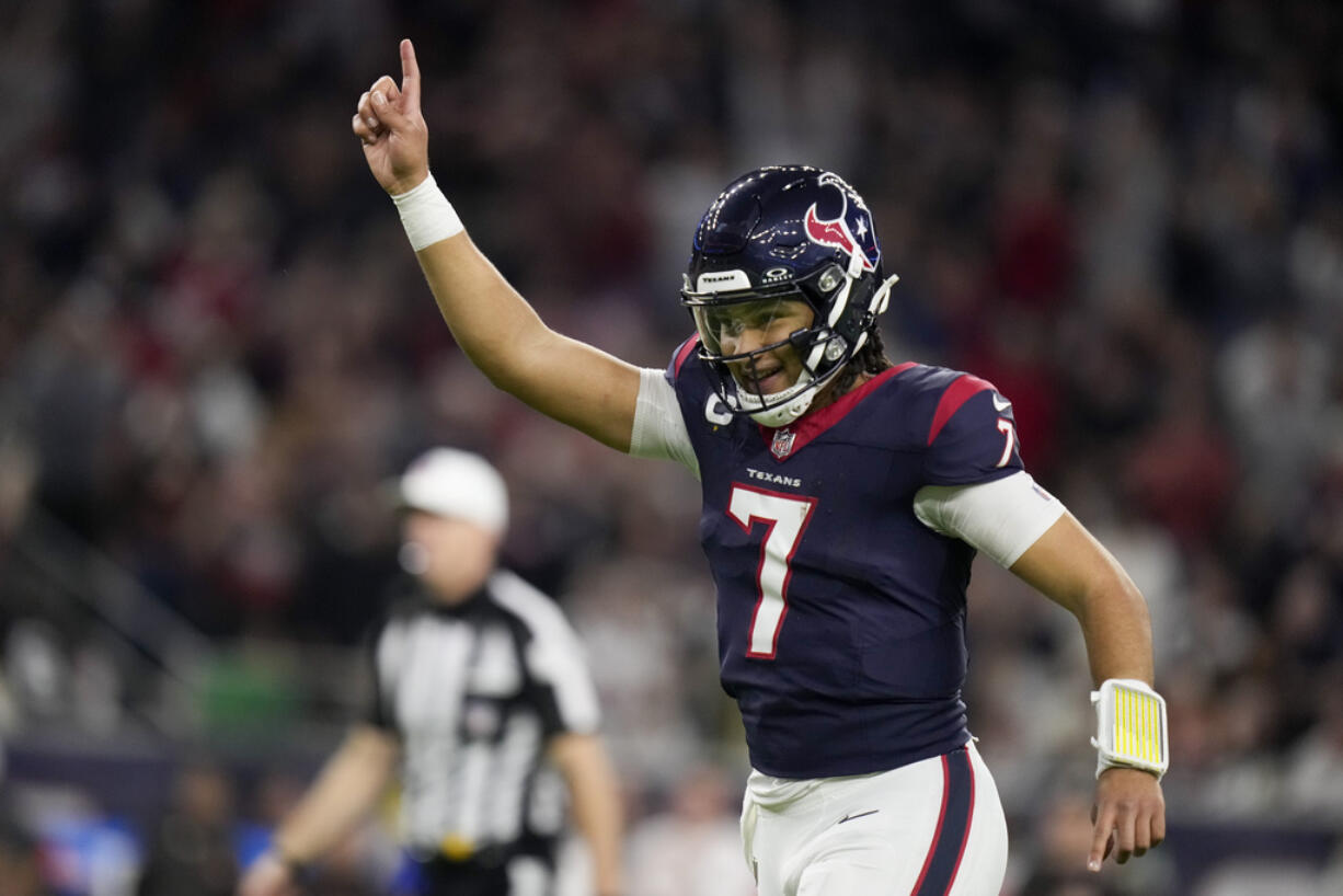 Houston Texans quarterback C.J. Stroud celebrates after a touchdown against the Cleveland Browns during the second half of an NFL wild-card playoff football game Saturday, Jan. 13, 2024, in Houston.