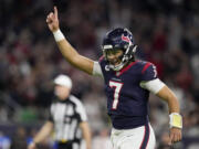 Houston Texans quarterback C.J. Stroud celebrates after a touchdown against the Cleveland Browns during the second half of an NFL wild-card playoff football game Saturday, Jan. 13, 2024, in Houston.