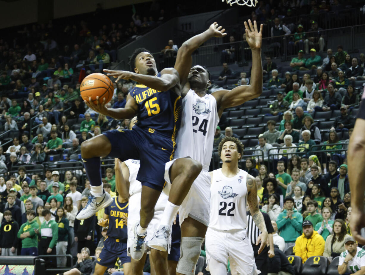 California guard Jalen Cone (15), shoots against Oregon forward Mahamadou Diawara (24), during the second half of an NCAA college basketball game in Eugene, Ore., Saturday, Jan. 13, 2024.