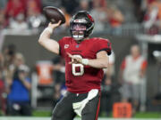 Tampa Bay Buccaneers quarterback Baker Mayfield throws a pass against the Philadelphia Eagles during the first half of an NFL wild-card playoff football game, Monday, Jan. 15, 2024, in Tampa, Fla.