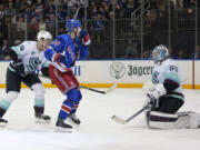 New York Rangers right wing Kaapo Kakko (24) reacts after scoring against Seattle Kraken goaltender Chris Driedger (60) during the second period of an NHL hockey game Tuesday, Jan. 16, 2024, at Madison Square Garden in New York.