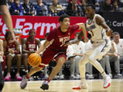 Washington State guard Myles Rice (2) drives past California guard Keonte Kennedy (3) during the second half of an NCAA college basketball game, Saturday, Jan. 20, 2024, in Berkeley, Calif. (AP Photo/D.