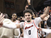 Oregon State guard Jordan Pope, center, celebrates his game-winning, 3-point basket against Arizona in an NCAA college basketball game Thursday, Jan. 25, 2024, in Corvallis, Ore. Oregon State won 83-80.