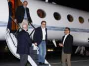 U.S. Special Presidential Envoy for Hostage Affairs Roger Carstens, right, greets freed Americans Siamak Namazi, Morad Tahbaz and Emad Shargi, as well as two returnees whose names have not yet been released by the U.S. government, who were released in a prisoner swap deal between U.S and Iran, as they arrive at Davison Army Airfield, Sept. 19, 2023 at Fort Belvoir, Va. By any standard, the past 18 months have been remarkable for getting wrongfully detained Americans home. There were major swaps with adversaries like Iran and Russia, including one that secured the freedom of WNBA star Brittney Griner, and a large prisoner exchange just last month with Venezuela.