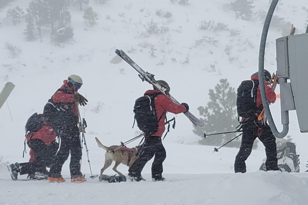 Rescue crews work at the scene of an avalanche Wednesday at the Palisades Tahoe ski resort near Lake Tahoe, Calif. One person was killed.