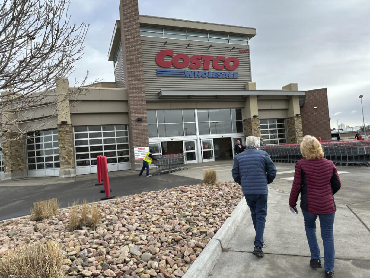 Shoppers head into a Costco warehouse Thursday, Jan. 11, 2024, in Sheridan, Colo.