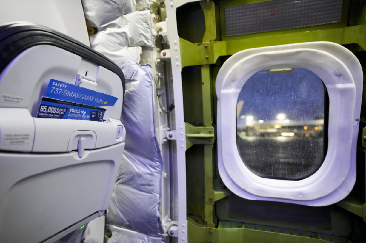 A door plug area of an Alaska Airlines Boeing 737 Max 9 aircraft awaiting inspection is pictured with paneling removed at the airline&#039;s facilities at Seattle-Tacoma International Airport Wednesday, Jan. 10, 2024, in SeaTac, Wash. On a Jan. 5 Alaska Airlines flight, a panel used to plug an area reserved for an exit door blew open midair, forcing it to return to Portland, Ore.