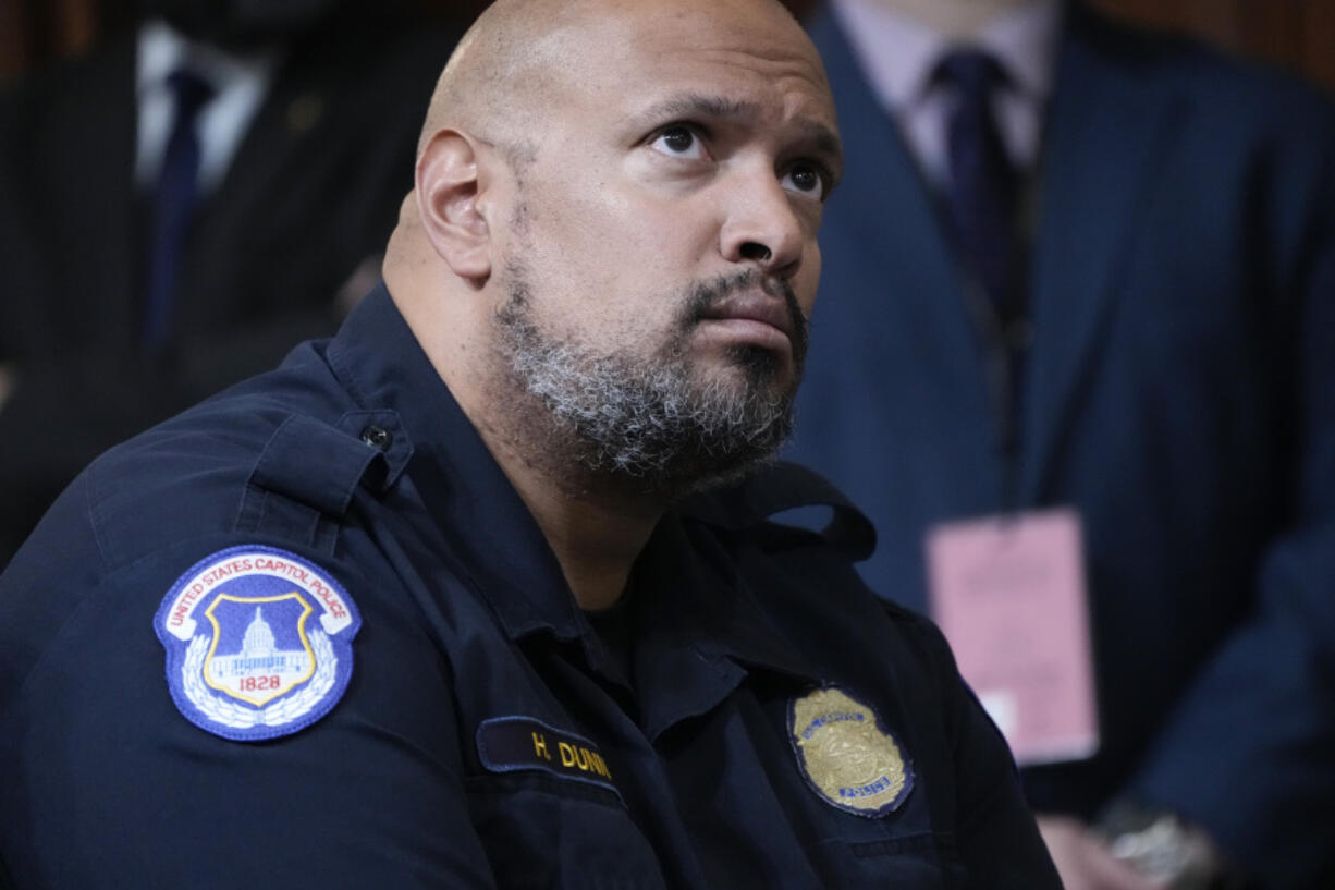 FILE - U.S. Capitol Police Sgt. Harry Dunn listens as the House select committee investigating the Jan. 6 attack on the U.S. Capitol holds its final meeting on Capitol Hill in Washington, Monday, Dec. 19, 2022. Dunn, who defended the U.S. Capitol on Jan. 6 announced Wednesday, Jan. 3, 2024 he is running for Congress in Maryland.