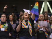 Shelby Ruch-Teegarden, center, of Garrett-Evangelical Theological Seminary, joins other protesters Feb. 26, 2019, during the United Methodist Church&rsquo;s special session of the general conference in St. Louis.