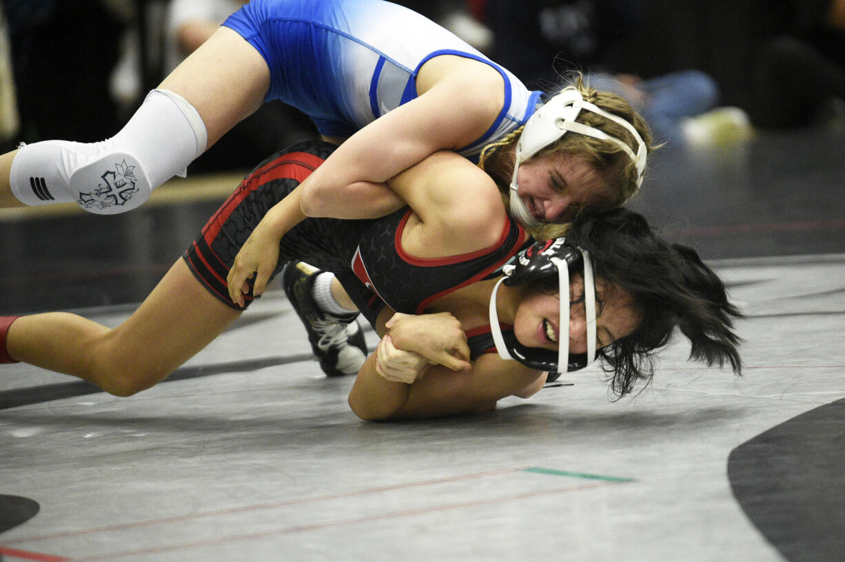 Leah Wallway of La Center (top) wrestles Jasmine Cha of Camas in the girls final at 105 pounds at the 53rd annual Norm Friehauf Clark County Championships wrestling tournament at Union High School on Saturday, Jan. 27, 2024.