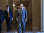 Senate Minority Leader Mitch McConnell, R-Ky., walks to the chamber at the Capitol in Washington, Thursday, Jan. 25, 2024, with bipartisan negotiations on border security unresolved. (AP Photo/J.