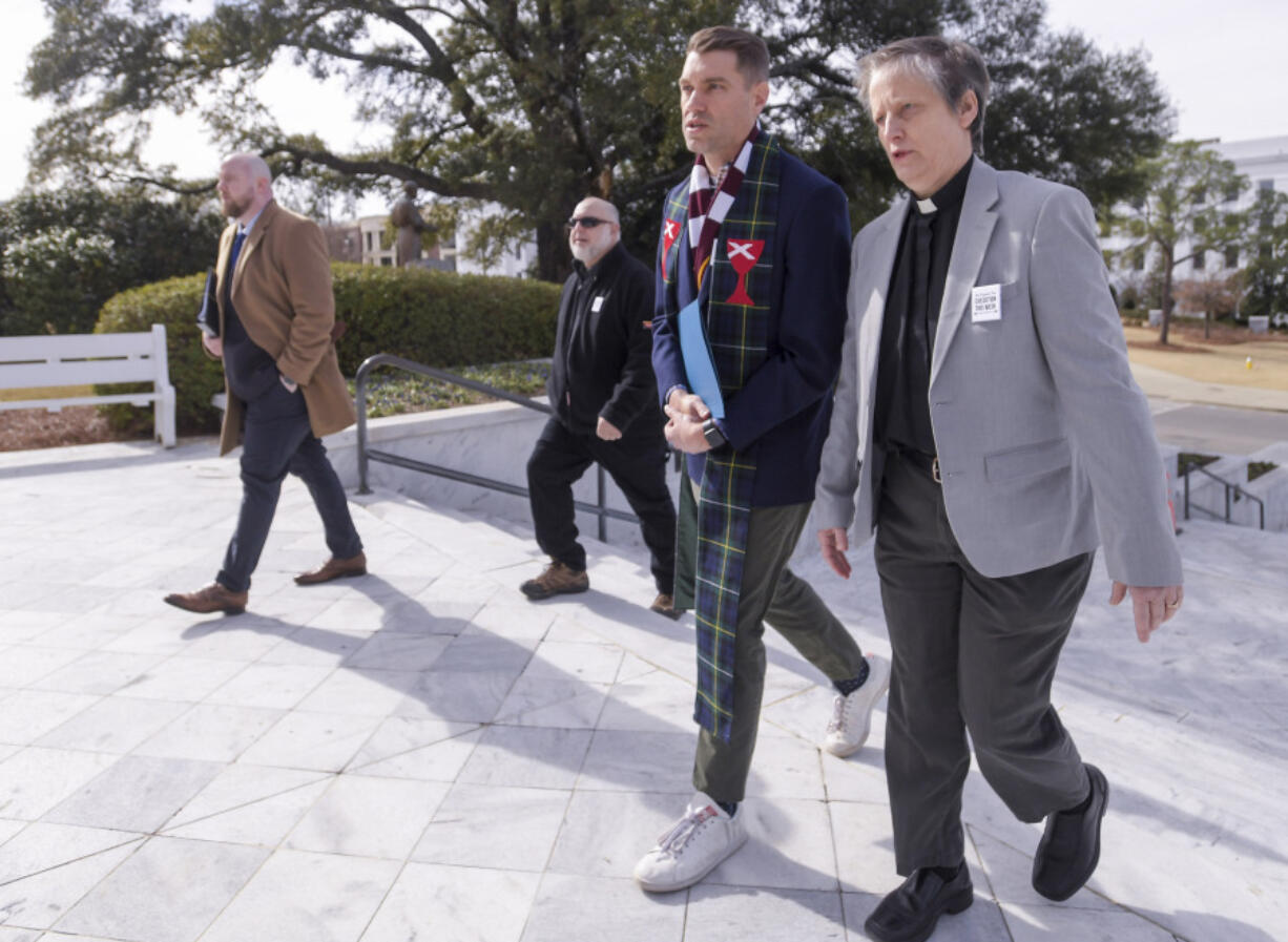 Pastors Shane Isner, left, and Lynn Hopkins deliver a letter from faith leaders statewide to the state capitol building in Montgomery, Ala., on Monday Jan. 22, 2024, asking Gov. Kay Ivey to stop the planned execution of Kenneth Eugene Smith.