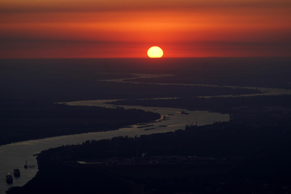 FILE - Ships travel along the Mississippi River in LaPlace, La., as the sun sets on Oct. 20, 2023. The nation&rsquo;s rivers and streams remain stubbornly polluted with nutrients that can contaminate drinking water, degrade aquatic life and feed the so-called &ldquo;dead zone&rdquo; in the Gulf of Mexico, according to a recently released Environmental Protection Agency assessment.