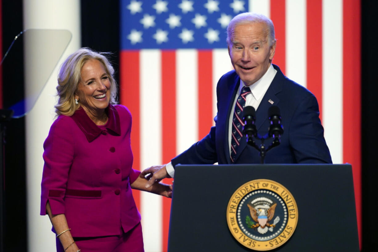 President Joe Biden and first lady Jill Biden stand on stage after Biden spoke in Blue Bell, Pa., Friday, Jan. 5, 2024.