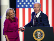 President Joe Biden and first lady Jill Biden stand on stage after Biden spoke in Blue Bell, Pa., Friday, Jan. 5, 2024.