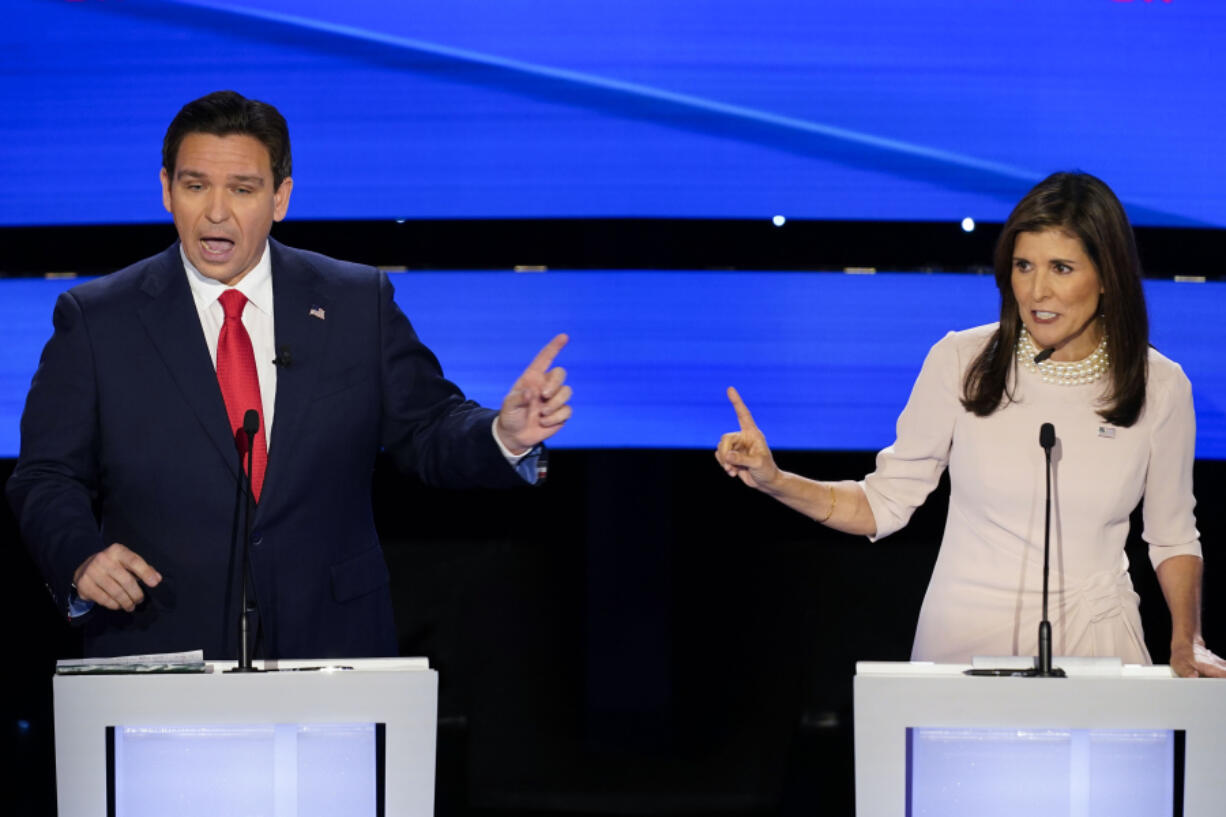 Former UN Ambassador Nikki Haley, right, and Florida Gov. Ron DeSantis, left, both speaking at the at the CNN Republican presidential debate at Drake University in Des Moines, Iowa, Wednesday, Jan. 10, 2024.