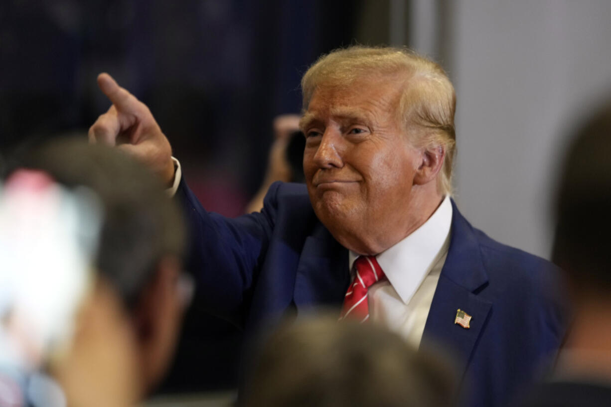 Republican presidential candidate former President Donald Trump greets people after speaking during a commit to caucus rally, Saturday, Jan. 6, 2024, in Clinton, Iowa.