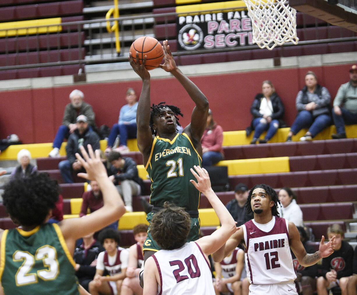 Evergreen senior Arthur Ban (21) takes a shot during a Class 3A Greater St. Helens League boys basketball game at Prairie High School on Tuesday, January 2, 2024.