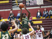 Evergreen senior Arthur Ban (21) takes a shot during a Class 3A Greater St. Helens League boys basketball game at Prairie High School on Tuesday, January 2, 2024.