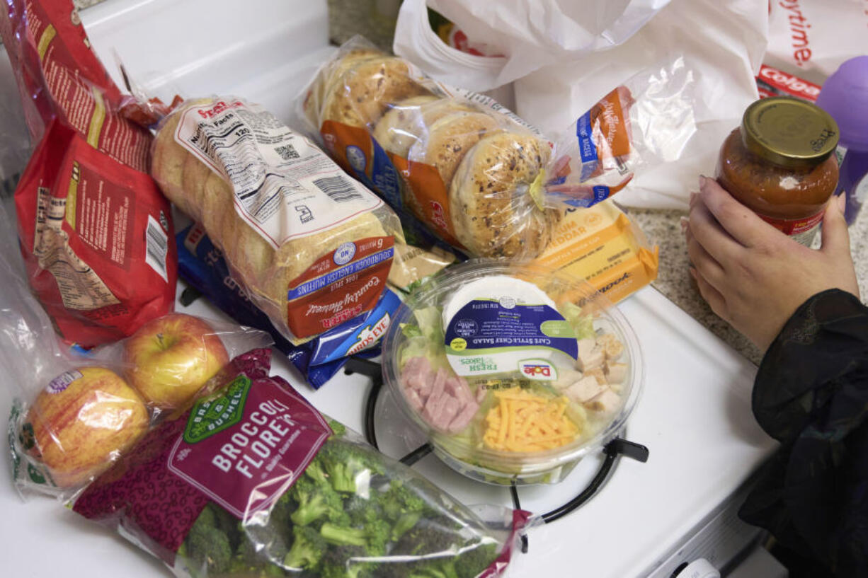 Groceries are displayed on a counter in Bellflower, Calif., on Monday, Feb. 13, 2023. Student and legal advocacy groups are petitioning the U.S. Department of Agriculture to lift the interview requirement for Supplemental Nutrition Assistance Program (SNAP) applicants to receive food aid. SNAP helps low-income families supplement their budgets so they can buy groceries, snacks, and non-alcoholic beverages. An estimated 42 million Americans currently receive the benefits at an average of $212 per person or $401 per household.