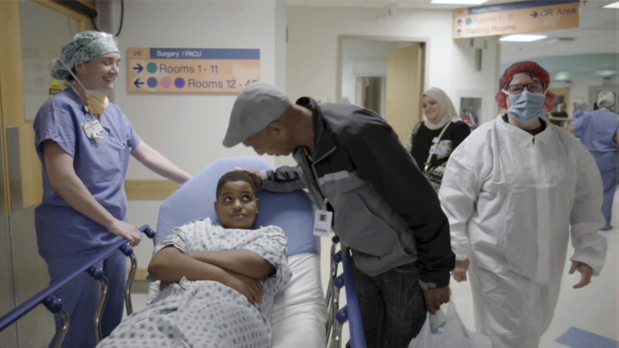 In this image from video, an 11-year-old boy who was born with hereditary deafness prepares for a gene therapy procedure in Philadelphia in October.