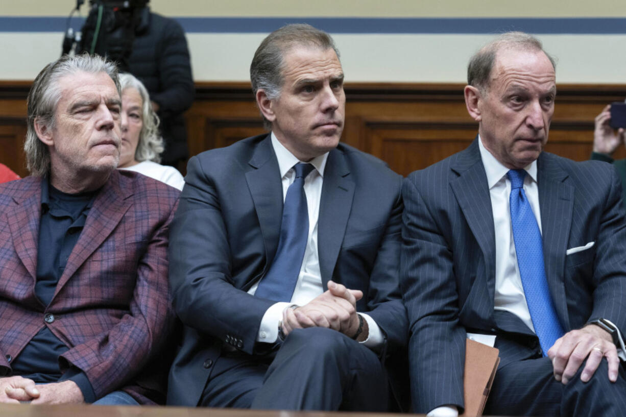 Hunter Biden, President Joe Biden&rsquo;s son, center, accompanied by his attorney Abbe Lowell, right, sit in the front row at a House Oversight Committee hearing as Republicans are taking the first step toward holding him in contempt of Congress, Wednesday, Jan. 10, 2024, on Capitol Hill in Washington.